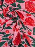 Heavy linen-look viscose with red floral print and green foliage 1
