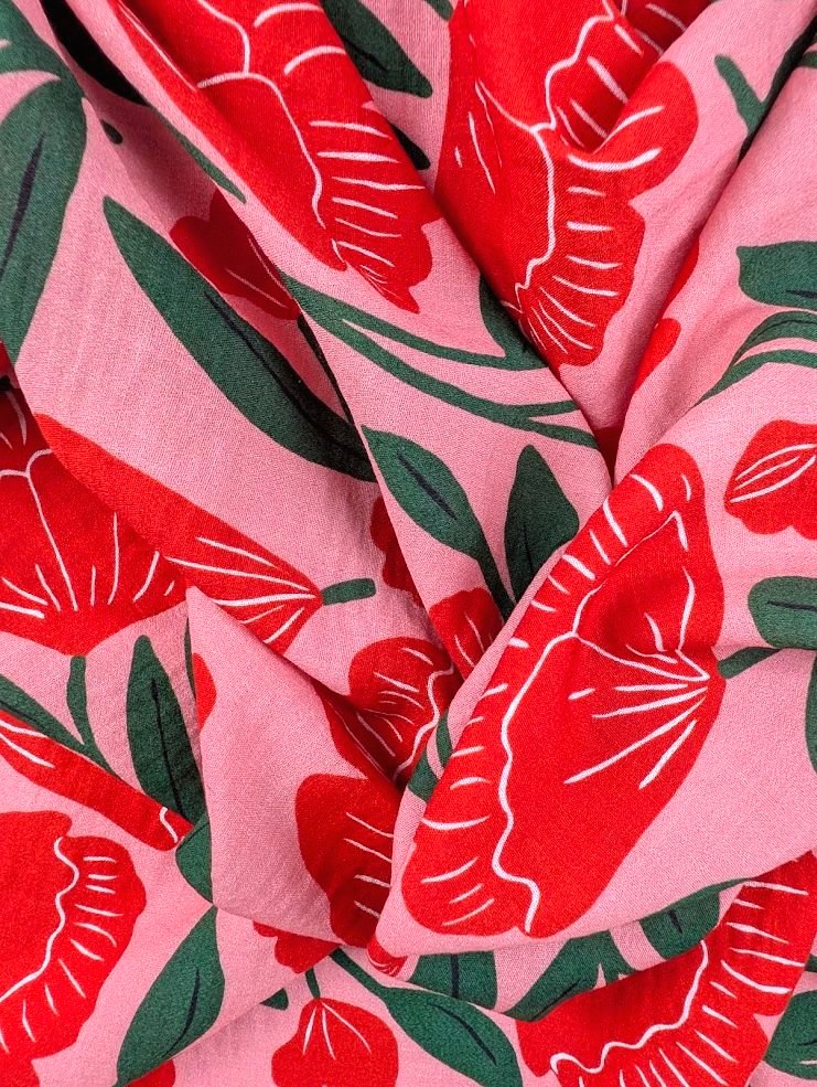 Heavy linen-look viscose with red floral print and green foliage 3